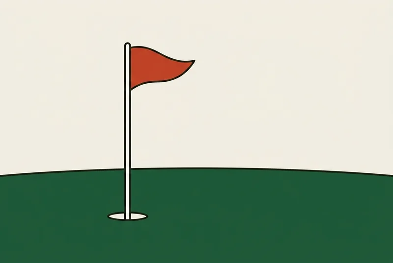 A golf flagstick standing in a hole on a putting surface