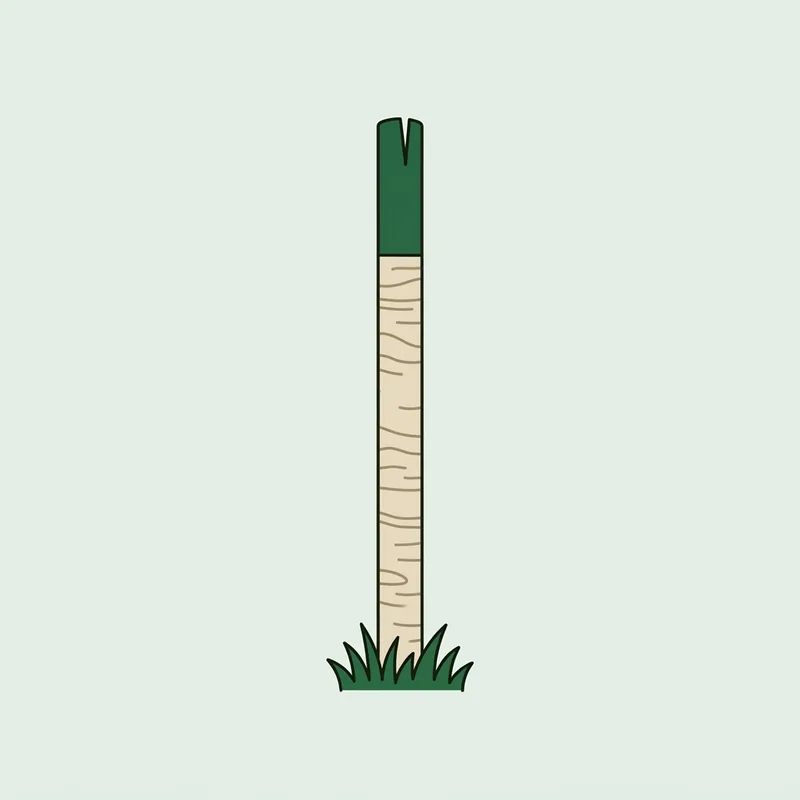 A single tall marker stake standing upright in short grass