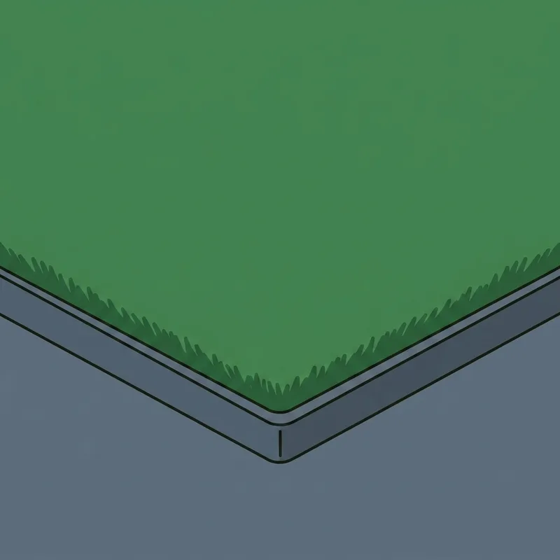 The corner of a thick artificial turf hitting mat on a bare concrete floor