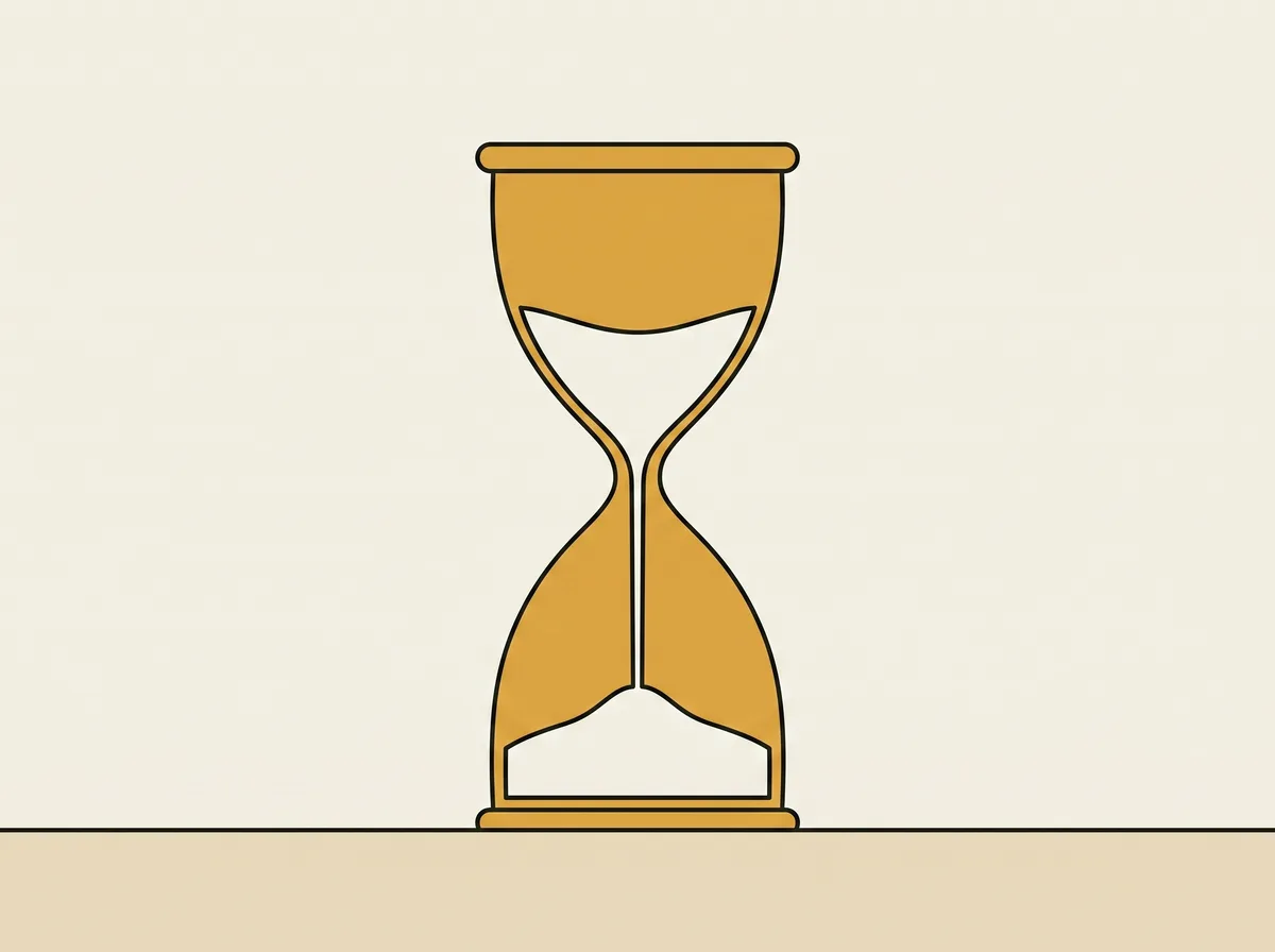A tall hourglass standing upright on a table with sand in the upper and lower bulbs
