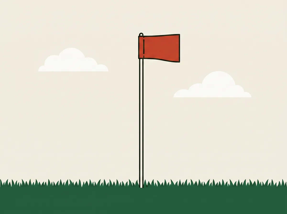 A flagstick standing in short grass with its pennant blown straight out sideways beneath two simple cloud shapes