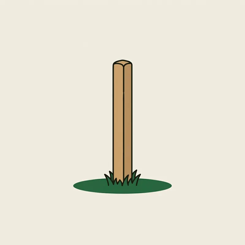 A short yardage marker post standing in short grass