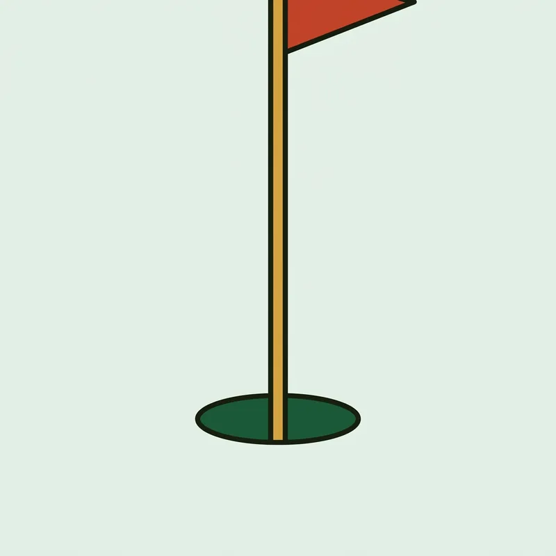 A flagstick standing in a hole cut on a putting green