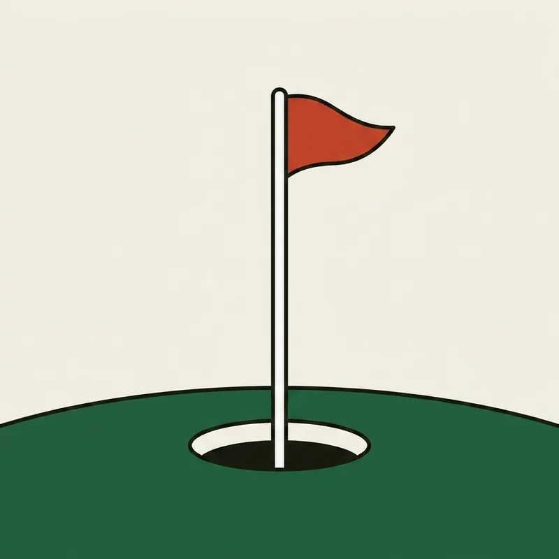 A golf hole with a flagstick standing in it, seen from close to the ground