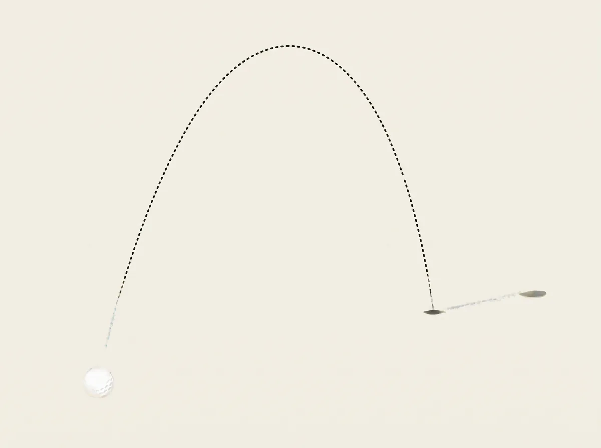 A tall dotted arc from a golf ball down to a landing mark, with a short line continuing on to a second mark further forward